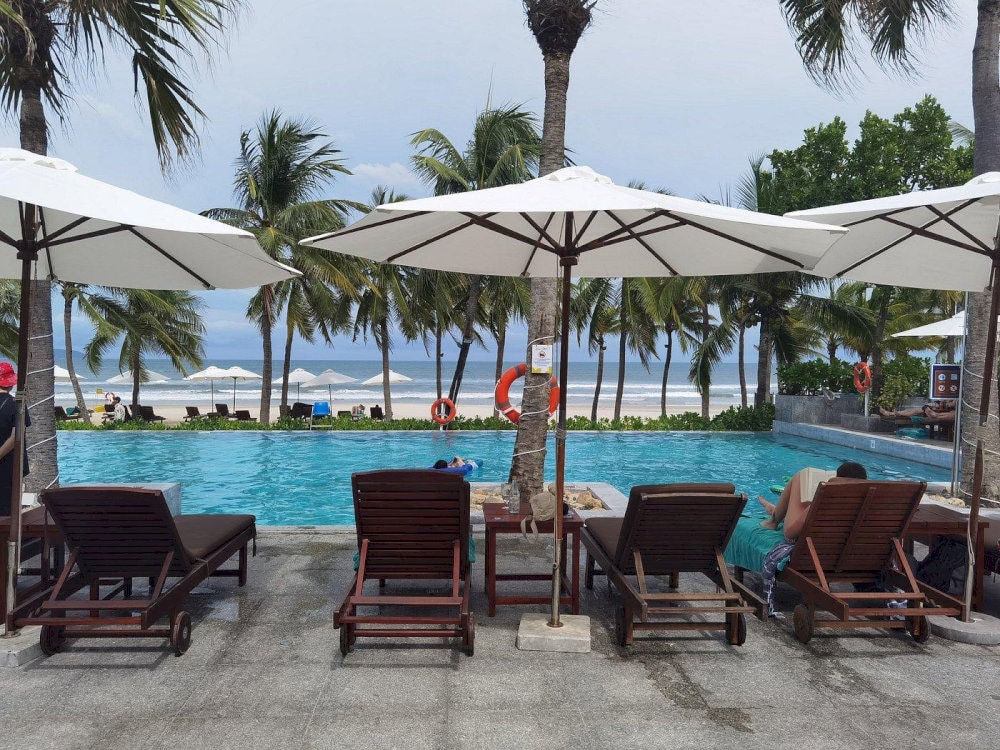 Escape to paradise where the pool meets the sea, and every hour feels like golden hour